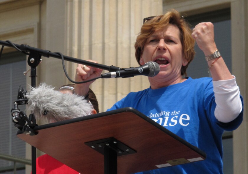 Randi Weingarten, president of the American Federation of Teachers, speaks at a rally for Kansas public schools in May. She criticized U.S. Education Secretary Arne Duncan for praising a court ruling against California's teacher job protections.