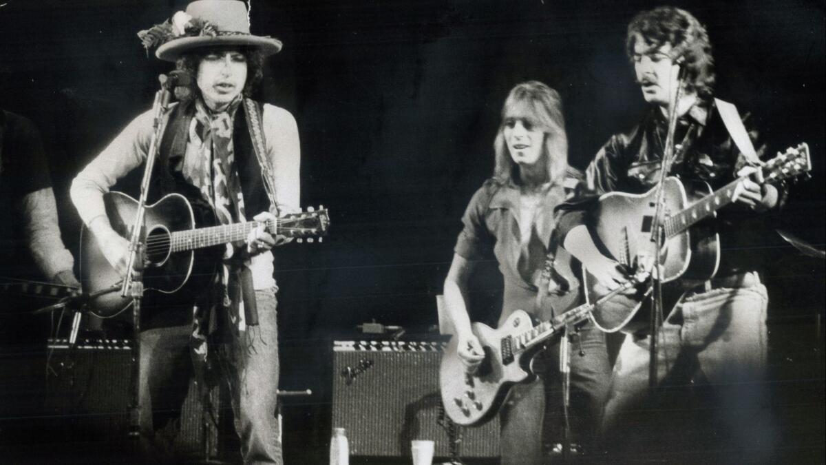 Bob Dylan, left, performed in Toronto in 1975 with a host of musicians, including Mick Ronson, center, and Bobby Neuwirth. Others at the show included Joni Mitchell, Joan Baez, Ramblin' Jack Elliott, Ronee Blakley, Roger McGuinn and Gordon Lightfoot.