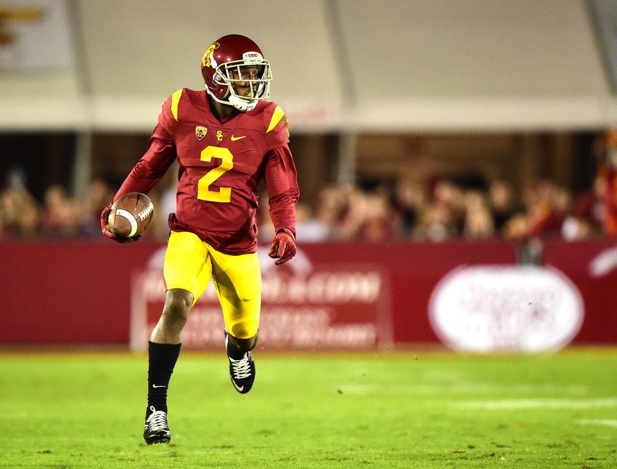 Adoree' Jackson gets a first down during the first quarter of a game against Arizona at the Coliseum on Nov. 7.