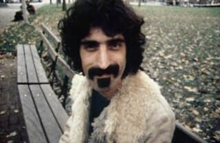 Frank Zappa on a park bench in the documentary "Zappa."