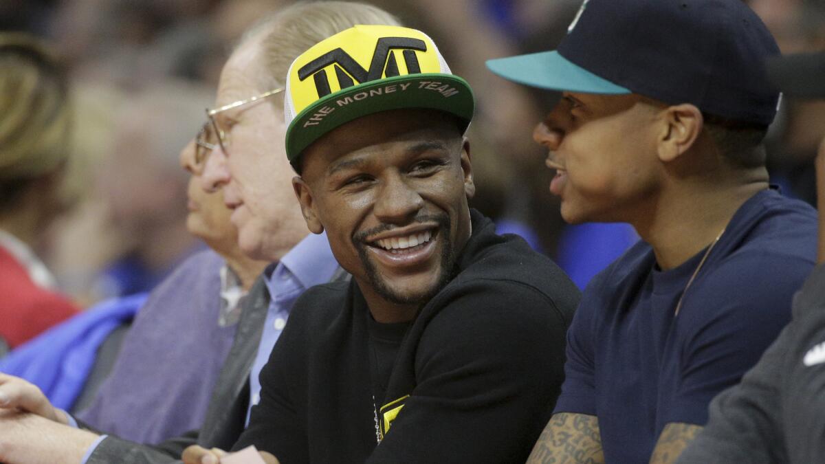 Floyd Mayweather Jr. sits courtside during Game 6 of the NBA Western Conference semifinals between the Clippers and Houston Rockets at Staples Center.