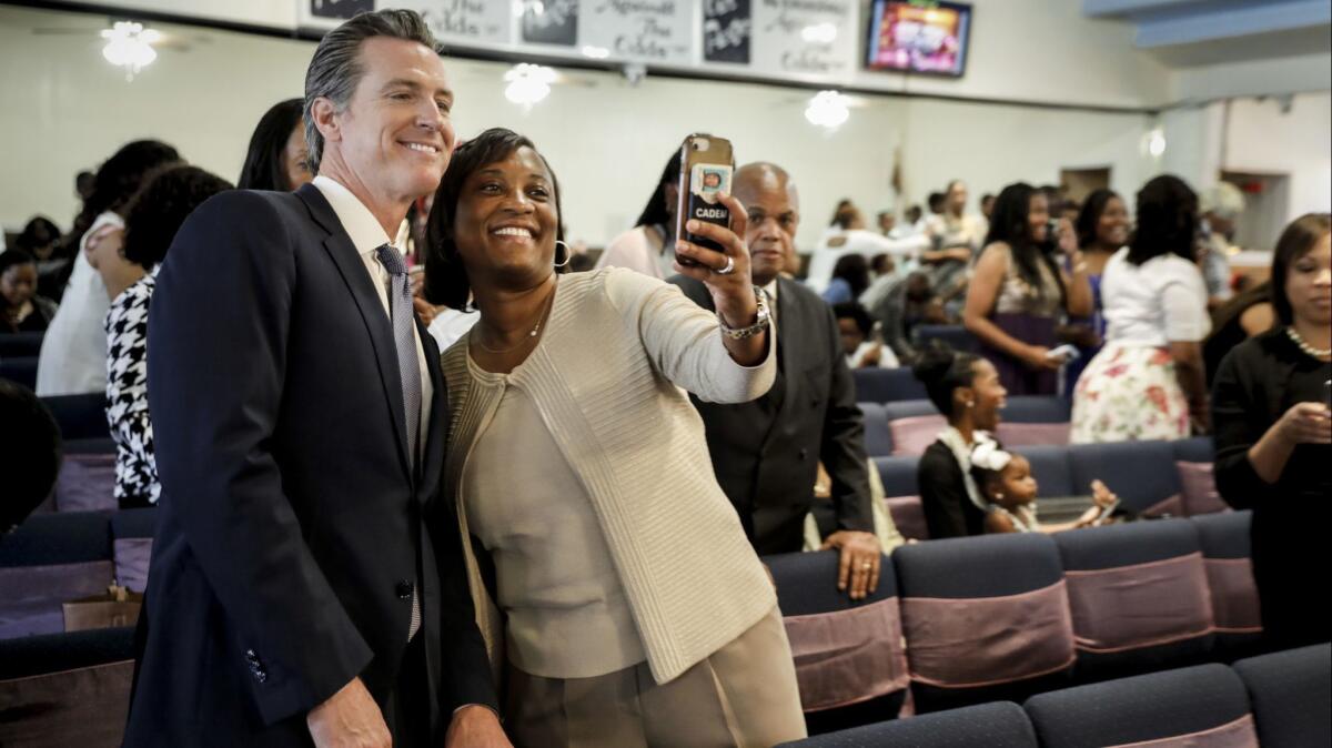 Laphonza Butler takes a selfie with Lt. Gov. Gavin Newsom during his campaign for governor in June.