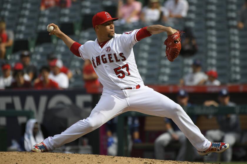 ANAHEIM, CA - SEPTEMBER 15: Hansel Robles #57 of the Los Angeles Angels pitches.