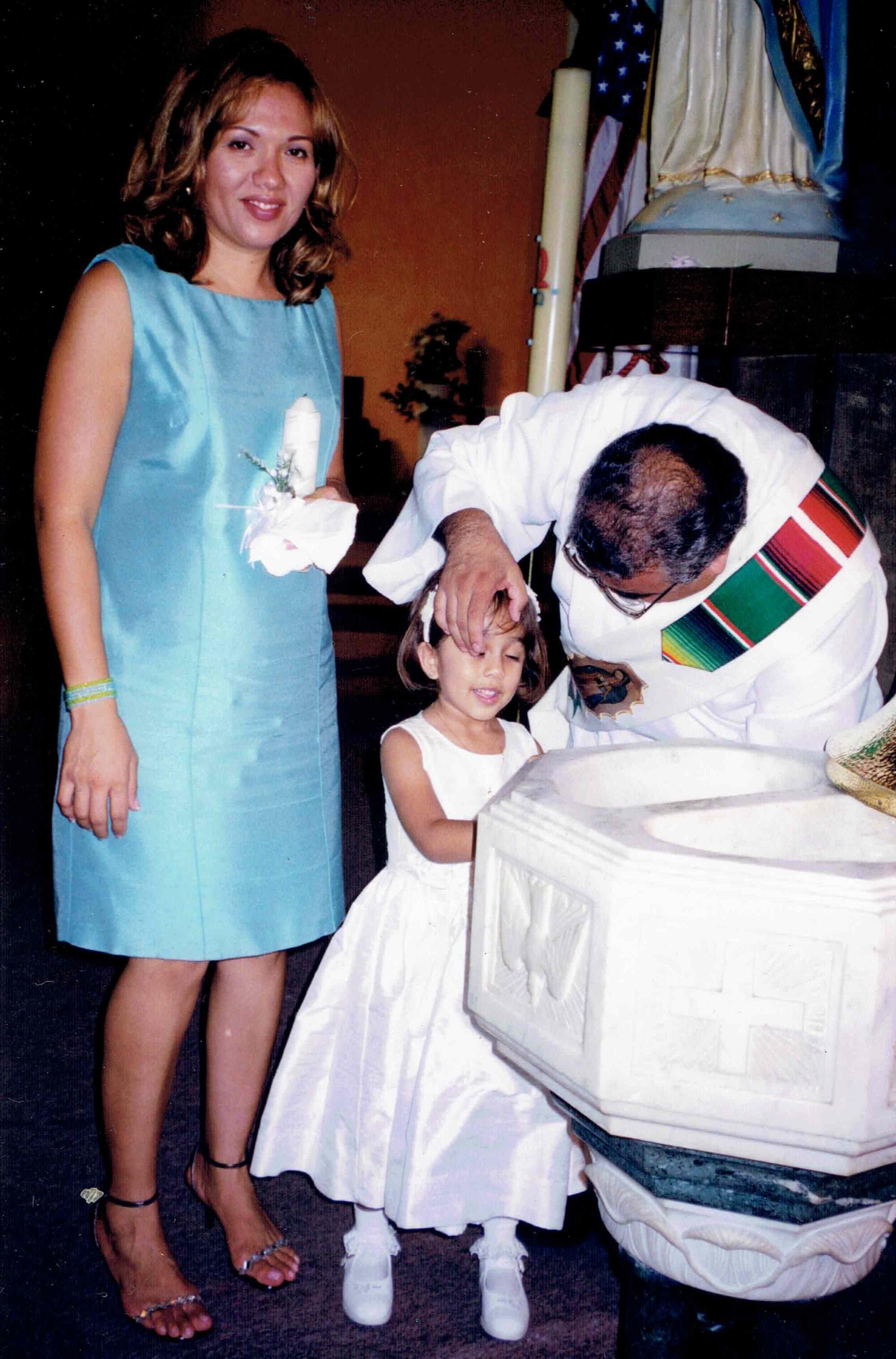 Gloria Verduzco and her daughter, Ilianna Salas, at her baptism. 