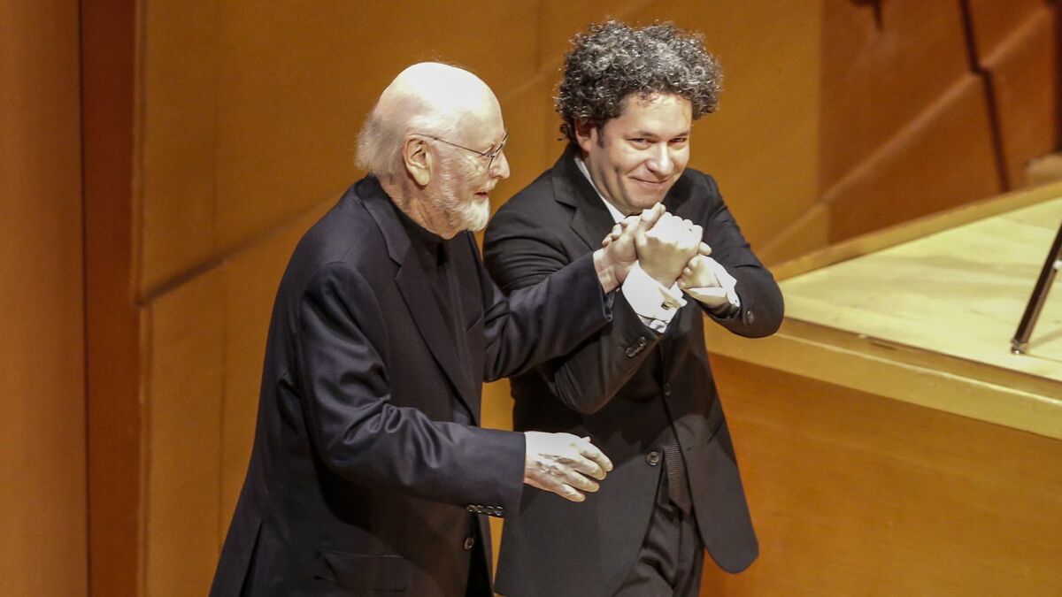 John Williams, left, with Gustavo Dudamel at the Los Angeles Philharmonic tribute to the film composer Thursday night at Walt Disney Concert Hall.
