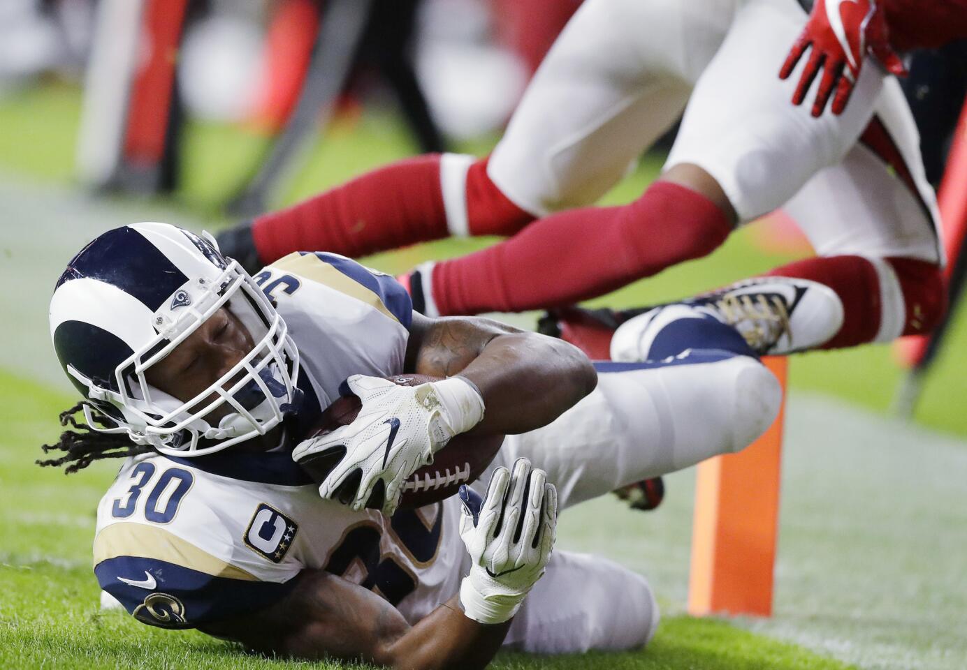 Rams running back Todd Gurley scores a touchdown against the Arizona Cardinals at Twickenham Stadium in London on Sunday.