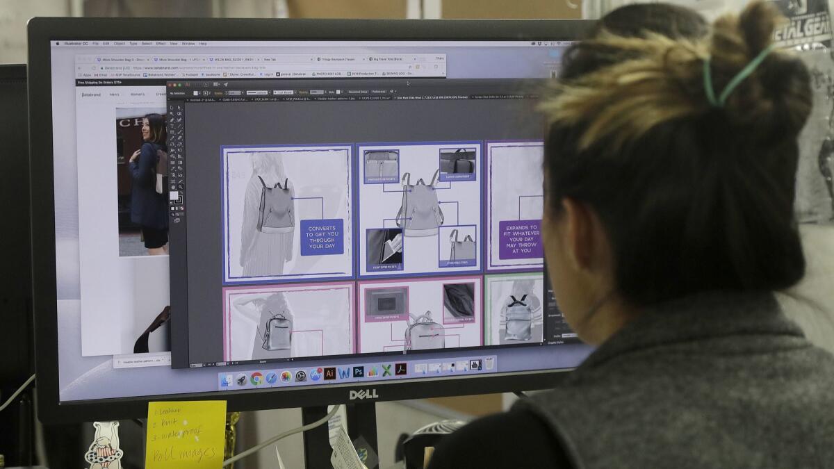 Betabrand designer Tiffany Tam shows sketches of a handbag on her computer.