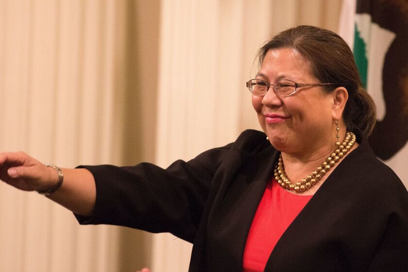 SACRAMENTO, CALIF. -- THURSDAY, JANUARY 21, 2016: California State Controller Betty Yee waves after being acknowledged during a joint session of the California Legislature for Governor Brown's State of the State speech in Sacramento, Calif., on Jan. 21, 2016. (Brian van der Brug / Los Angeles Times)