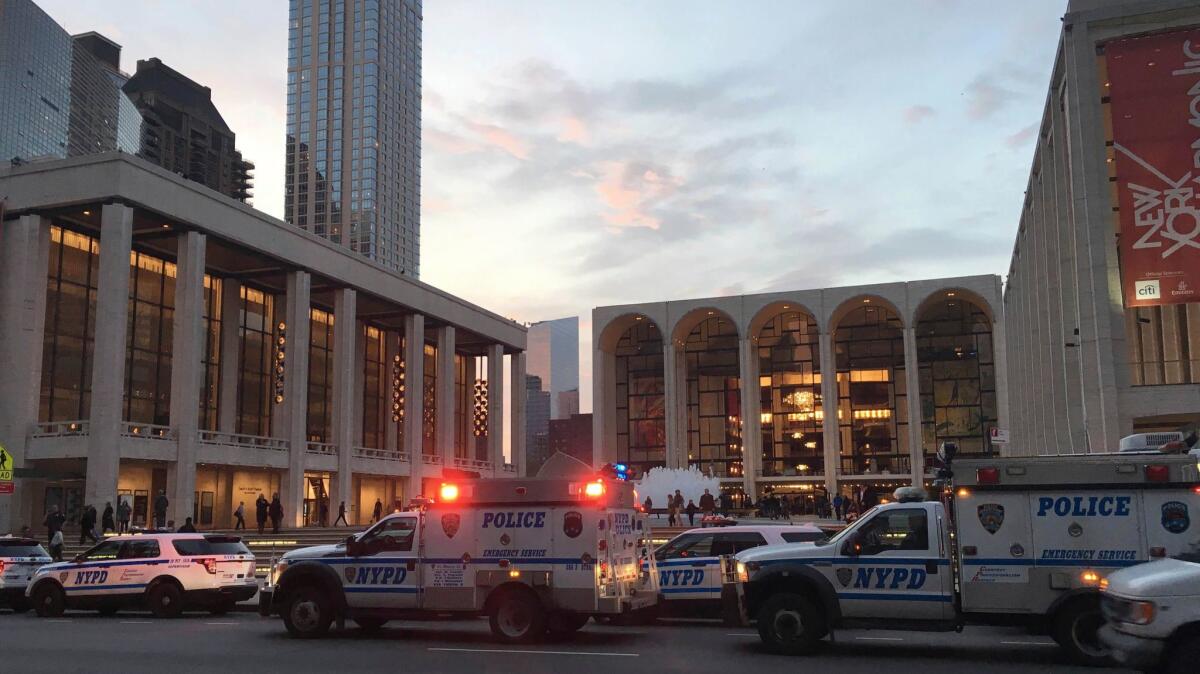 Police arrive at the Metropolitan Opera, which halted a performance after a man sprinkled a friend's ashes into the orchestra pit.