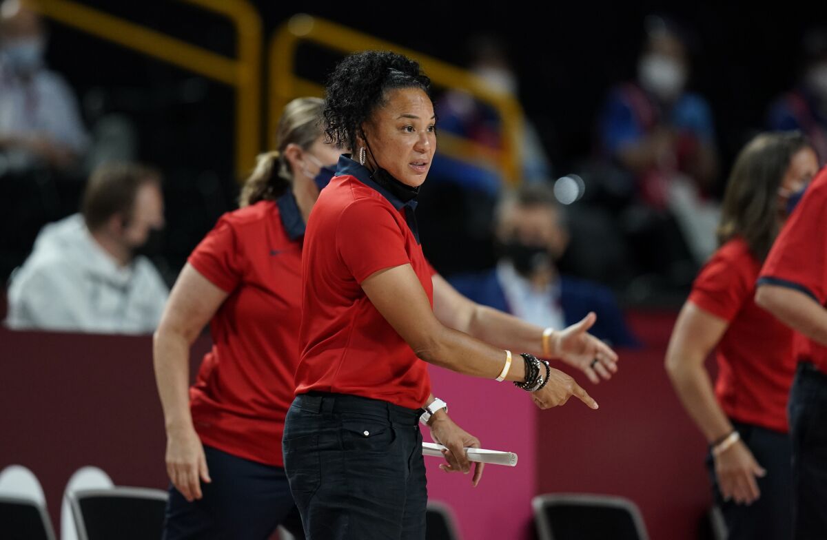United States' head coach Dawn Staley gestures to the players during women's basketball gold medal game against Japan at the 2020 Summer Olympics, Sunday, Aug. 8, 2021, in Saitama, Japan. (AP Photo/Charlie Neibergall)