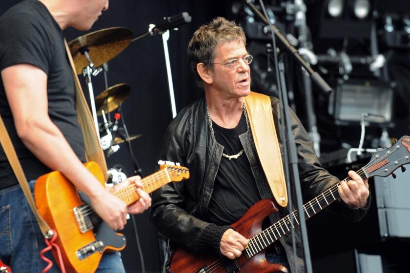 Lou Reed, right, shown during a 2011 performance in Brittany, France.