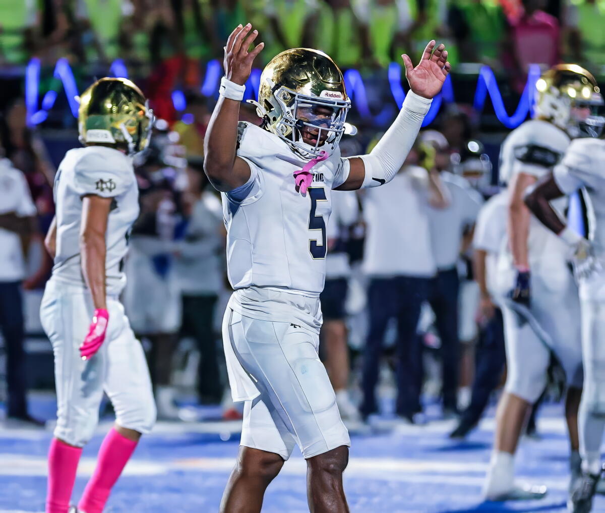Tahj Skinner of Sherman Oaks Notre DameHigh gives the touchdown signal during a win over Chaminade.