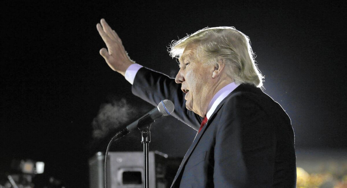 Republican presidential candidate Donald Trump waves to supporters after a campaign rally in Tyngsborough, Mass., on Oct. 16, 2015.