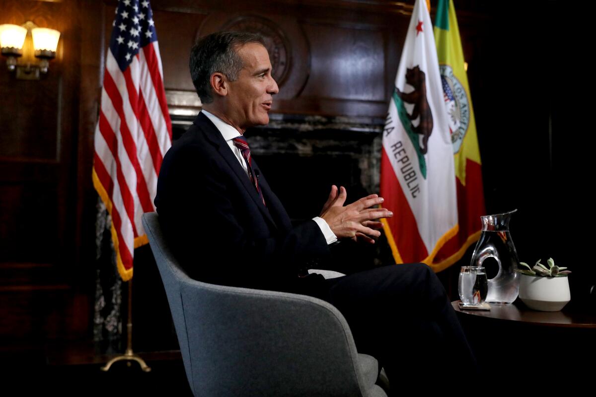 L.A. Mayor Eric Garcetti holds interviews with the media after President Joe Biden selected him as his nominee