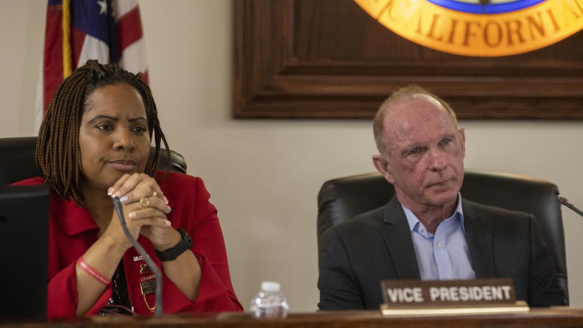 Antelope Valley Union High School District trustees Victoria Ruffin and Robert Davis at a board meeting April 18. A group of teachers has launched a recall effort against Ruffin, Davis and trustee Amanda Parrell.