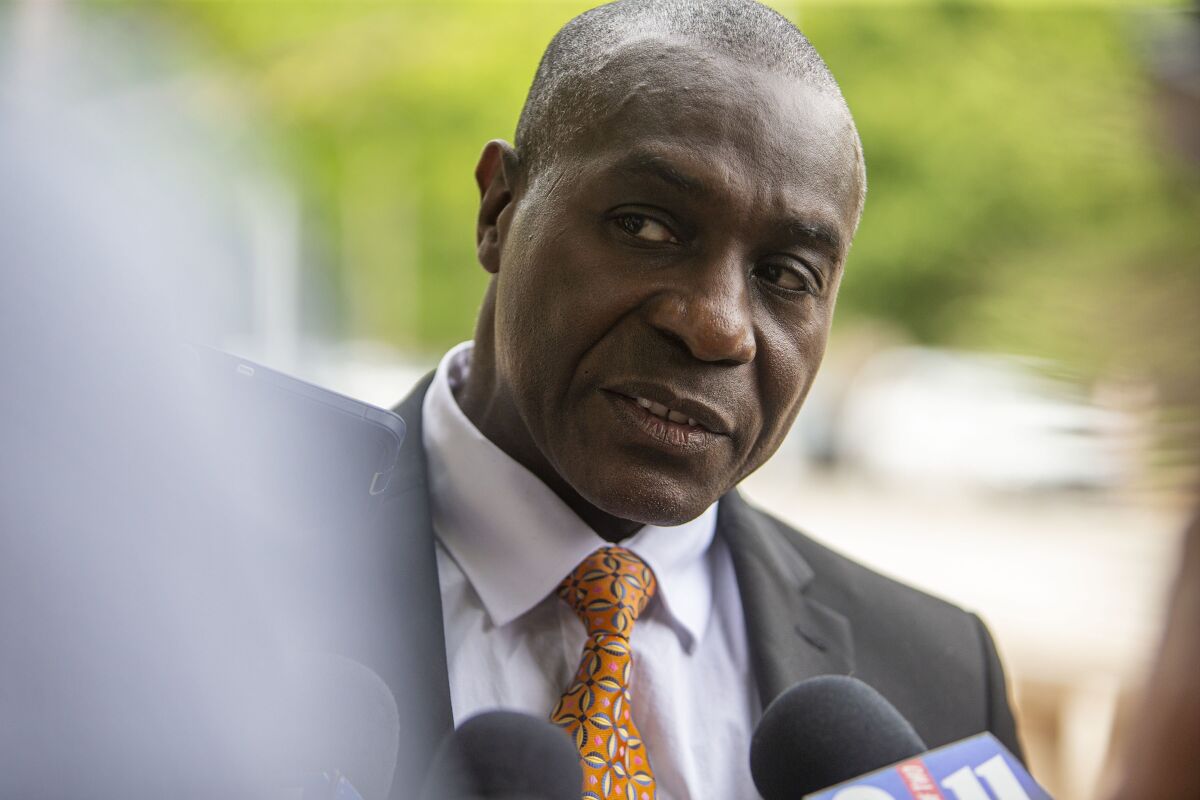 St. Louis Board of Aldermen President Lewis Reed speaks briefly with the media after leaving the Thomas F. Eagleton federal courthouse, Thursday, June 2, 2022, in St. Louis. Reed has resigned his post five days after federal charges were announced against him and two others for allegedly accepting bribes and misusing their offices for personal gain, the St. Louis Post-Dispatch reported, Tuesday, June 7 2022. (Zachary Clingenpeel/St. Louis Post-Dispatch via AP)