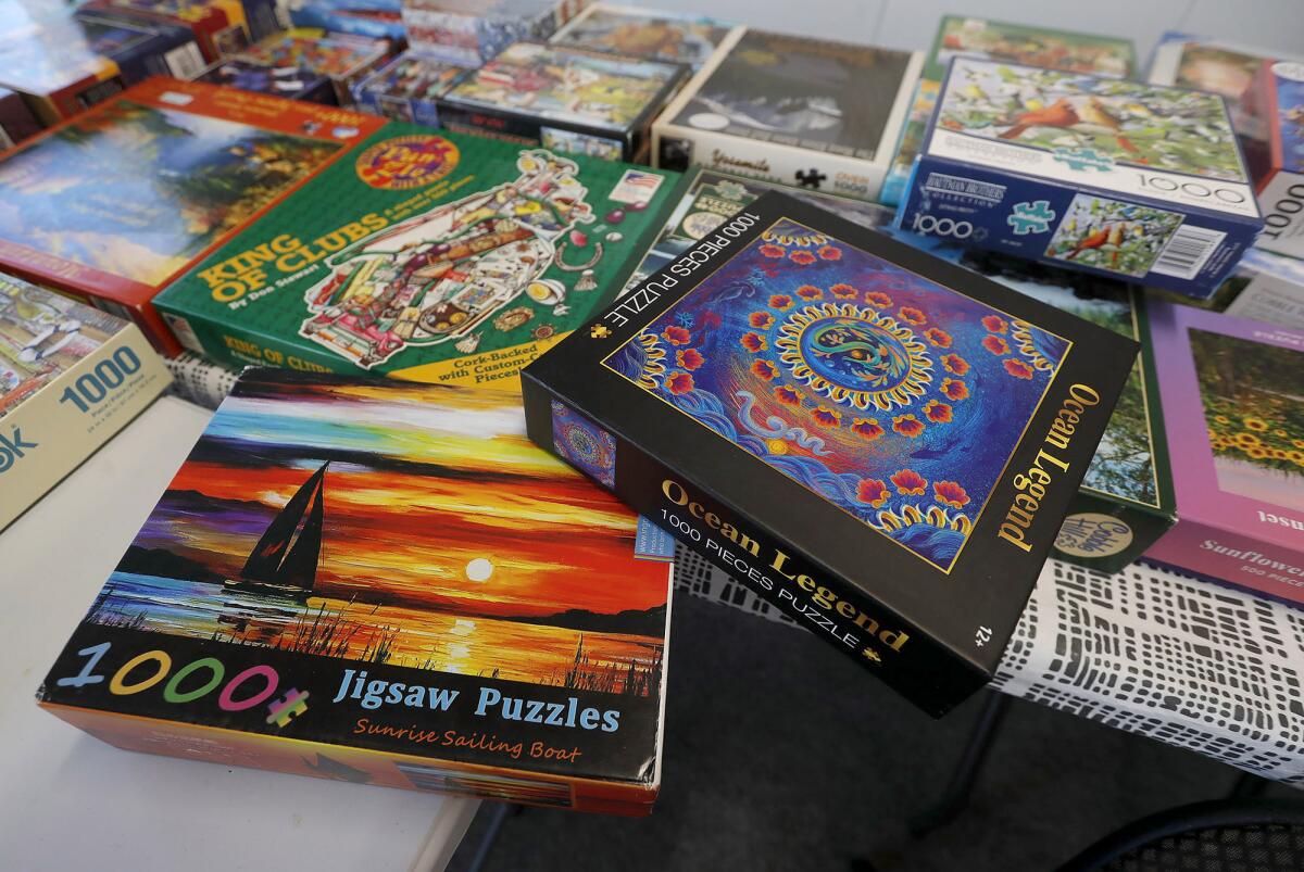 Some of the 200 or so puzzles at Mary Fewel's popular monthly puzzle exchange in Costa Mesa.