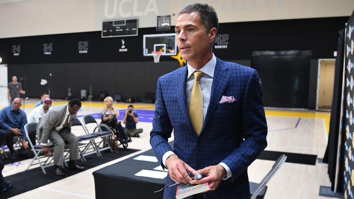 General manager Rob Pelinka exits the stage in El Segundo after addressing reporters about the Lakers' free-agency acquisitions. “We celebrate one thing, and that’s NBA championships,” Pelinka said.