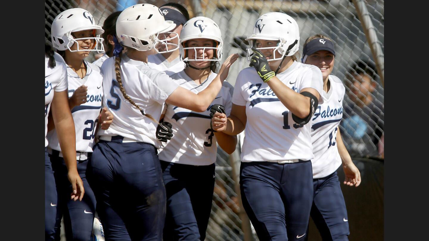 Crescenta Valley High School softball pitcher #19 Emily Mulcahey, right, and others celebrate her home run in home game vs. Arcadia High School, in La Crescenta on Thursday, May 11, 2017. CVHS won the game 6-4.