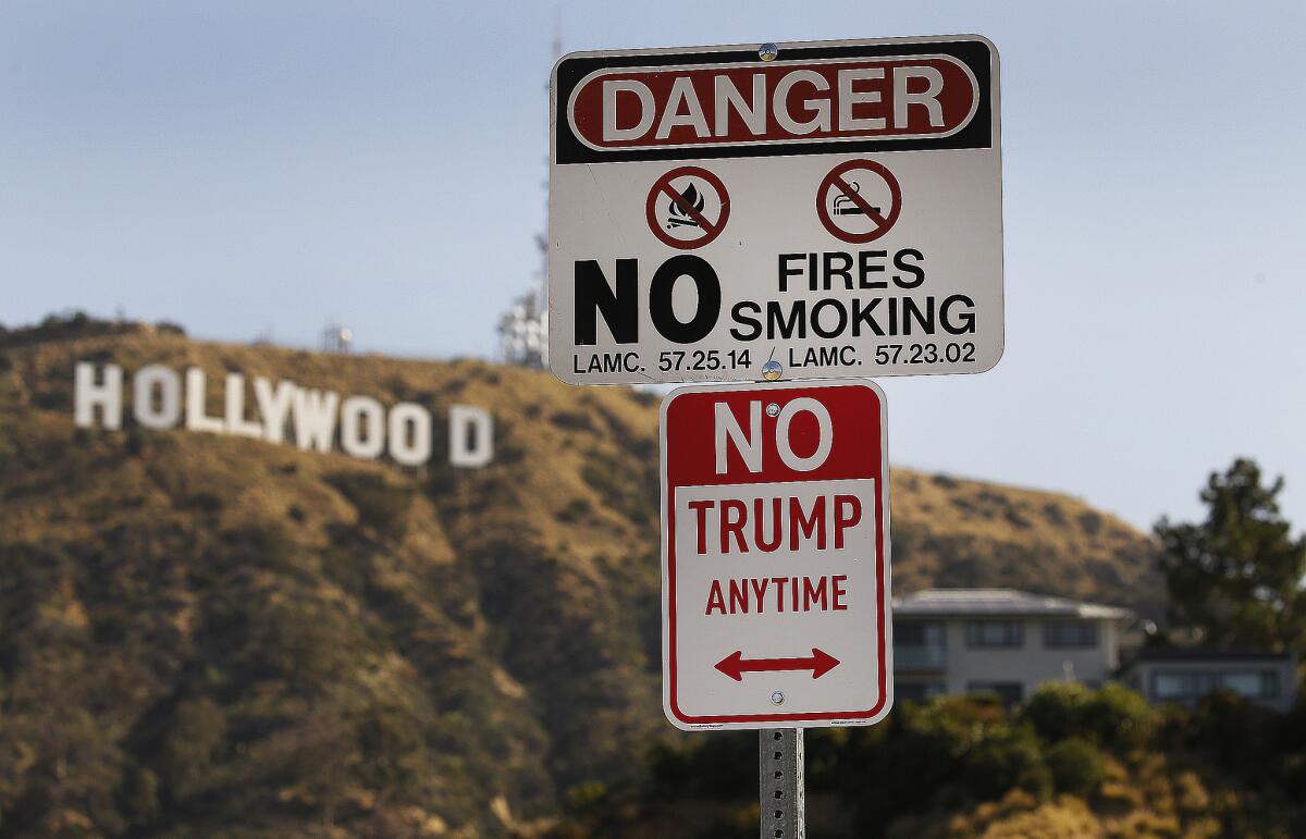 The art installation "No Trump Anytime" disguised as a parking sign in Hollywood. (Al Seib / Los Angeles Times)