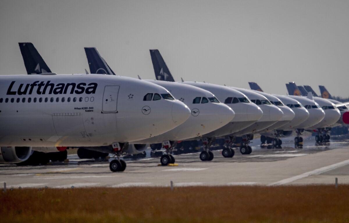 File- File picture taken June 3, 2020 shows Lufthansa aircrafts parking on a runway at the airport in Frankfurt, Germany. Lufthansa said Friday it has repaid all the German government aid it received last year to help the airline group through the coronavirus pandemic. (AP Photo/Michael Probst,file)
