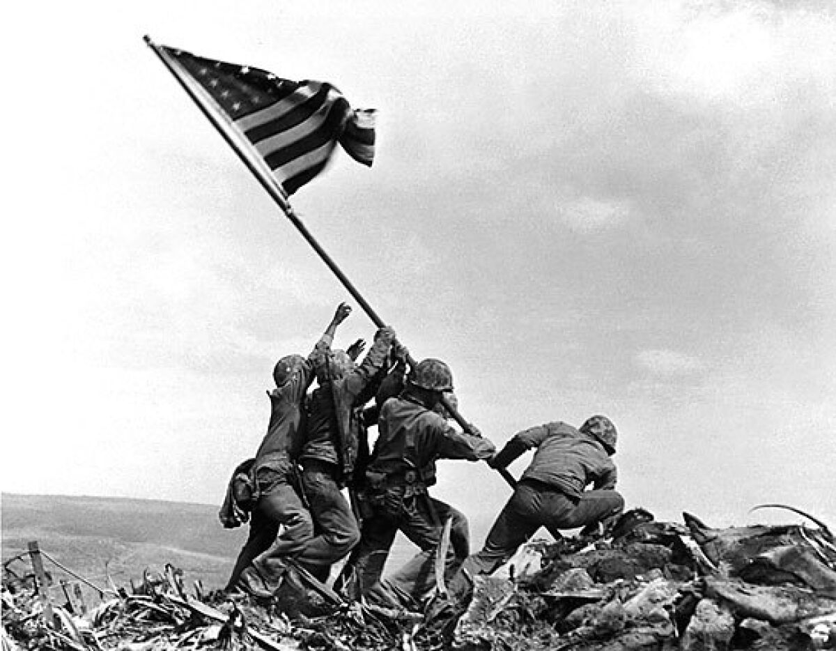 U.S. Marines raise the American flag atop Mt. Suribachi on Iwo Jima on Feb. 23, 1945.
