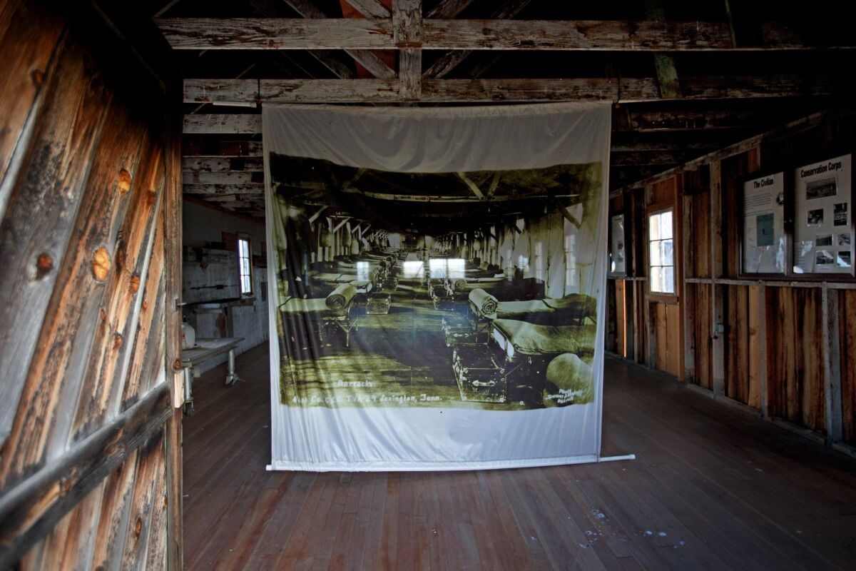 A banner hung in place in a barracks at Camp Tulelake depicts what it looked like when it housed Japanese American internees during World War II.