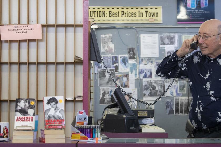 WEST HOLLYWOOD, CALIF. -- MONDAY, JANUARY 28, 2019: Barry Mason talks on the phone behind the counter at his iconic gay porn shop, Circus of Books, which is closing after nearly four decades on Santa Monica Boulevard in West Hollywood, Calif., on Jan. 28, 2019. (Brian van der Brug / Los Angeles Times)