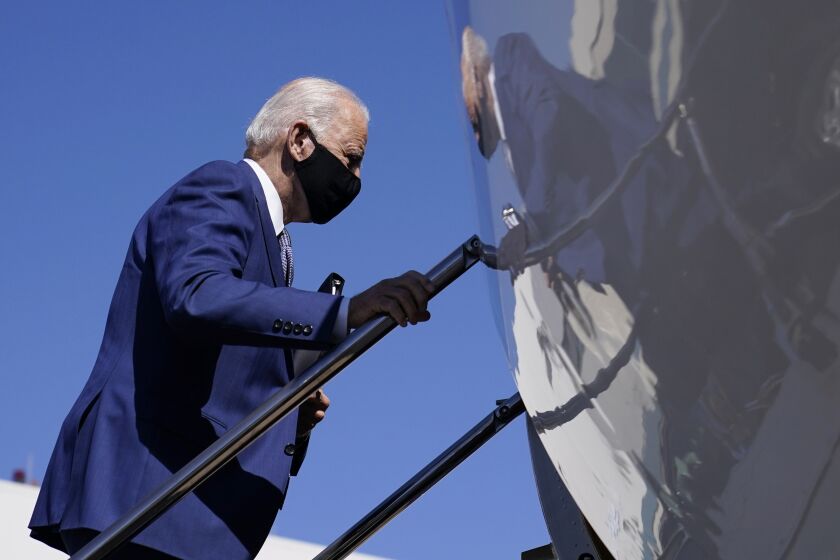 Democratic presidential candidate former Vice President Joe Biden boards a plane at New Castle Airport, in New Castle, Del., Monday, Sept. 21, 2020, en route to Manitowoc, Wis. (AP Photo/Carolyn Kaster)