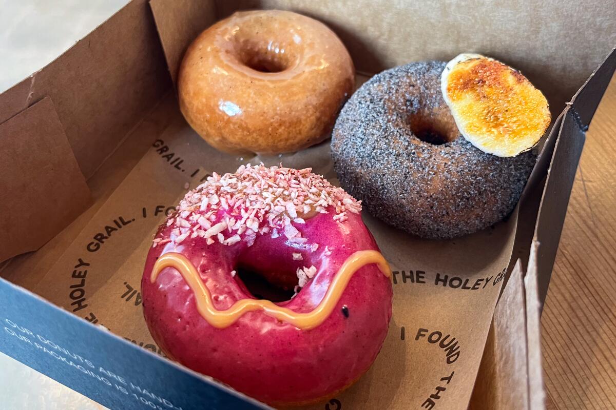 Three donuts in a box.