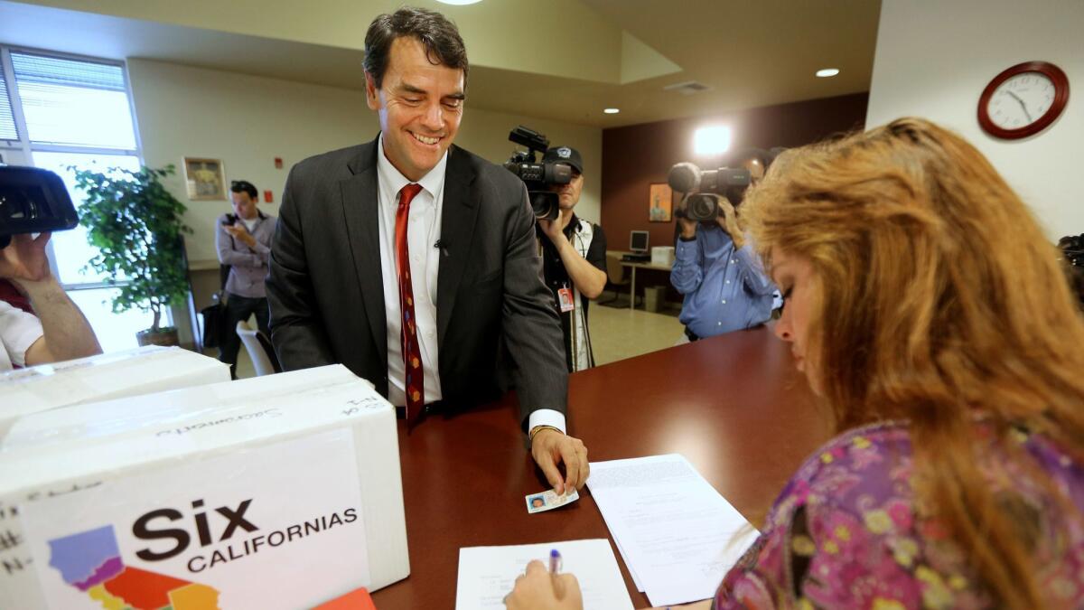 Silicon Valley venture capitalist Tim Draper in 2014, when he turned in boxes of petitions for a ballot initiative that would ask voters to split California into six states. The initiative did not qualify, and now he's back with a new plan to break California into three states.