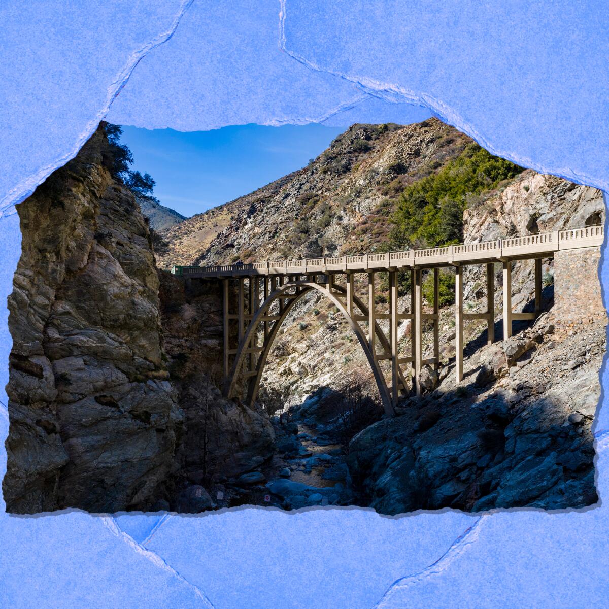 An arch bridge in the middle of the San Gabriel Mountains.