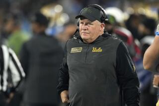 UCLA head coach Chip Kelly stands on the sideline during the first half of an NCAA college football game against Arizona Saturday, Nov. 12, 2022, in Pasadena, Calif. (AP Photo/Mark J. Terrill)