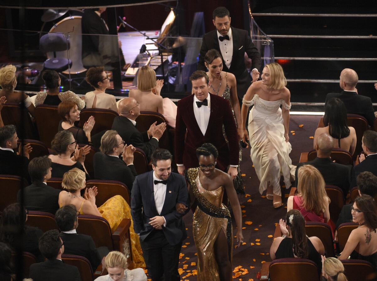 Jimmy Kimmel persuaded A-list Oscar attendees to briefly leave the Dolby Theatre and surprise moviegoers watching a preview of "A Wrinkle in Time." Among the game celebs: Lin-Manuel Miranda, Lupita Nyong'o, Armie Hammer, Gal Gadot and Margot Robbie.