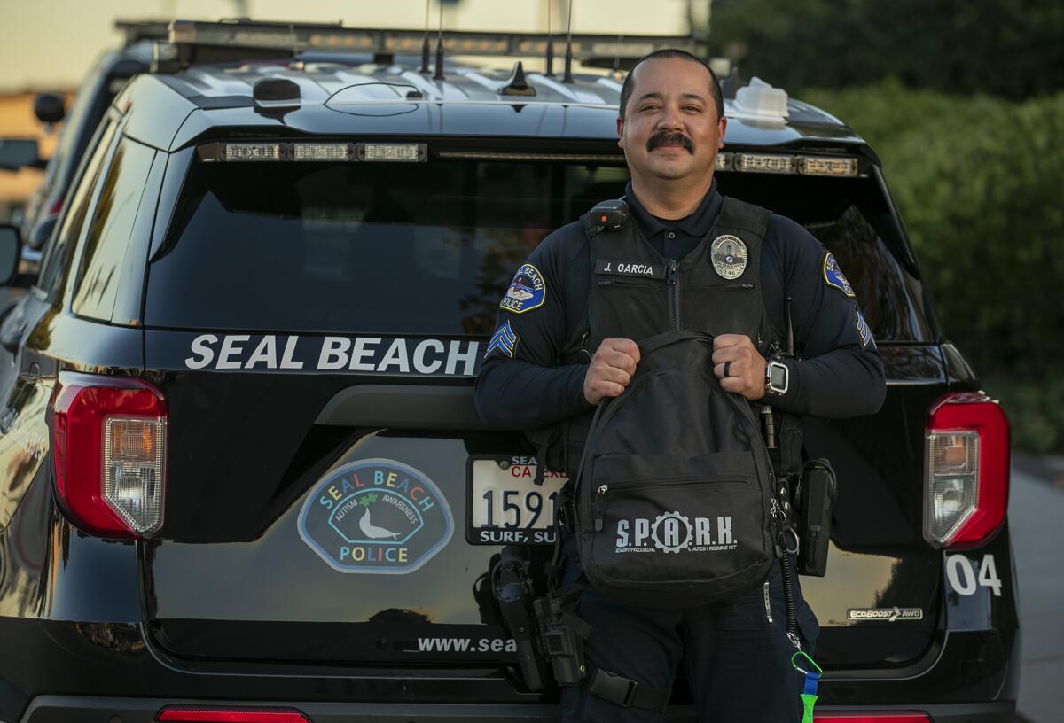 Seal Beach police Sgt. Joe Garcia shows a sensory kit designed to help officers interact with people with autism.