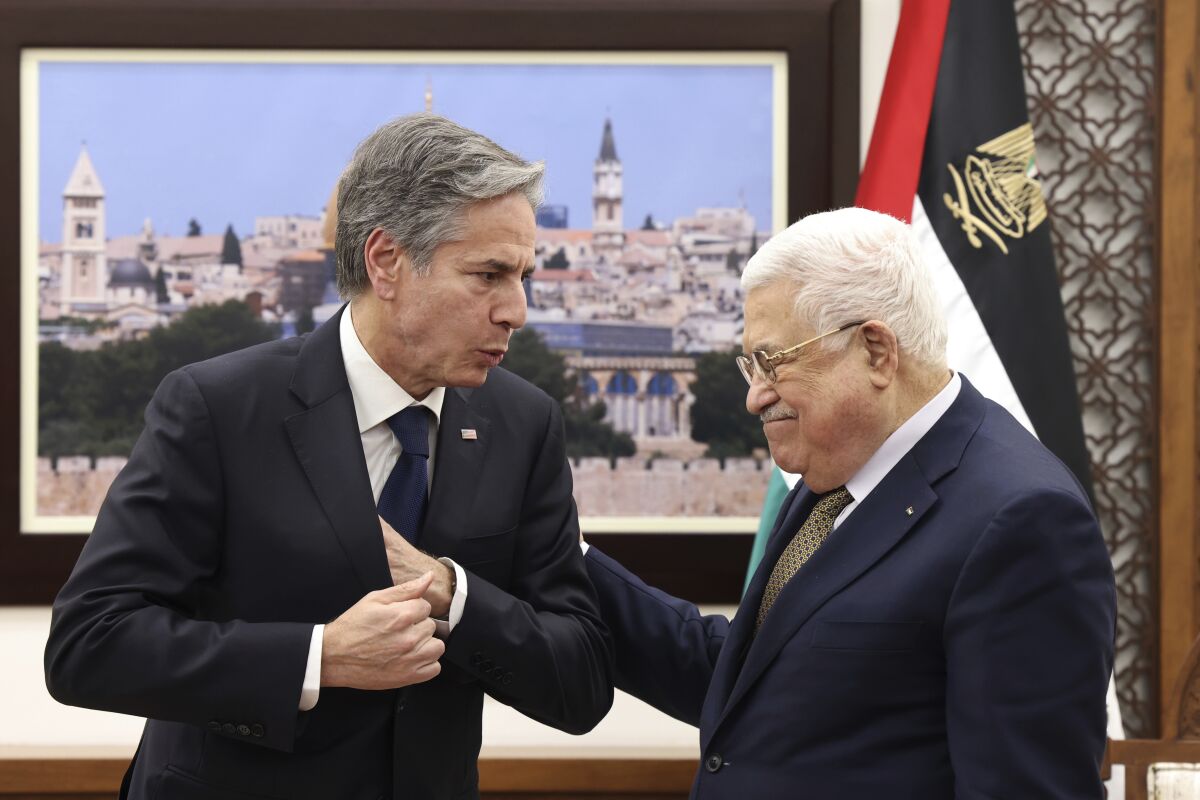 Secretary of State Antony J. Blinken talks to Mahmoud Abbas.
