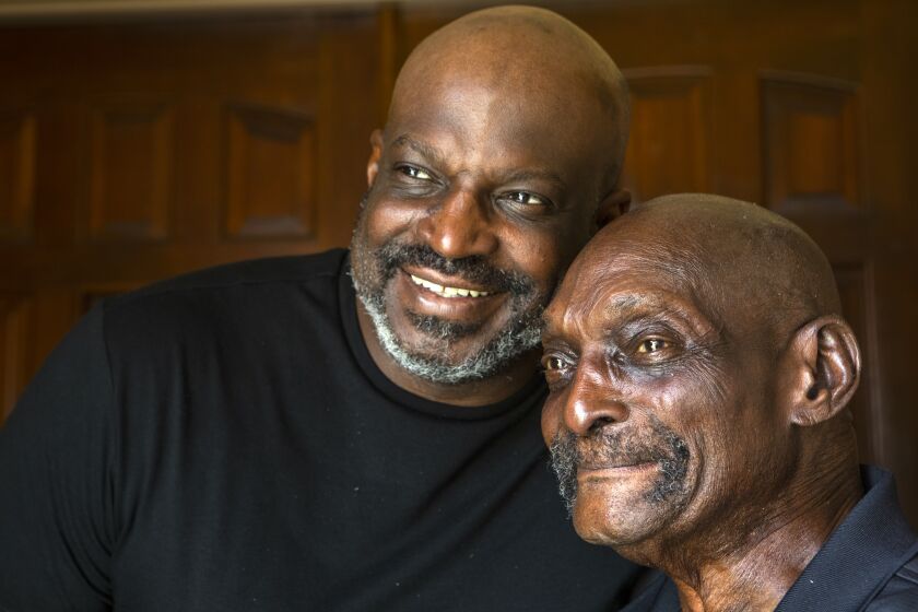 LOS ANGELES, CA - JUNE 13: Portrait of Robert Meeks, left, with his father Robert Meeks Jr., 82-years-old, right, on Monday, June 13, 2022, in Los Angeles, CA. Son Robert Meeks recounts the first time he saw his father Robert Meeks Jr. perform on a released recording of the rejected first episode of the 1960s music show "Shindig!" A health scare Robert Meeks Jr. had in 2019 spurred a renewed focus on listening to the story of his father's journey to California with his brothers to pursue a music dream. (Francine Orr / Los Angeles Times)