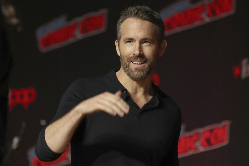 FILE - This Oct. 3, 2019 file photo shows Ryan Reynolds at New York Comic Con. Hollywood actors Ryan Reynolds and Rob McElhenney are officially the new owners of Welsh soccer club Wrexham, according to a formal takeover announcement Wednesday Feb. 10, 2021, (AP Photo/Steve Luciano, File)