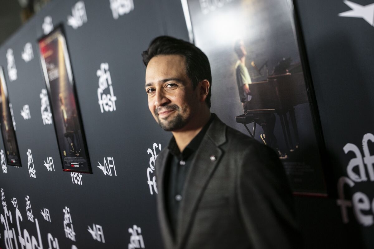 Director Lin-Manuel Miranda smiles at the camera at the premiere of Netflix's "Tick, Tick … Boom!"