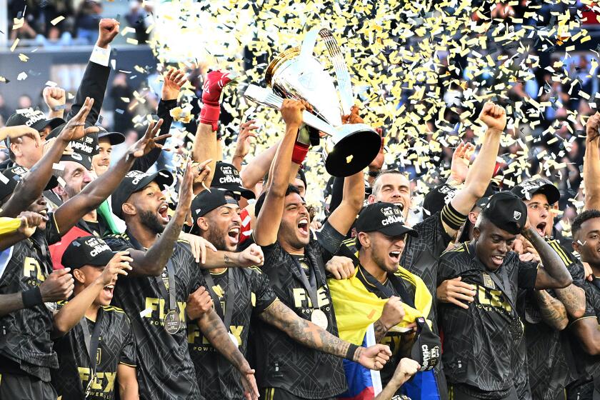 Los Angeles, California November 5, 2022-LAFC players celebrate the MLS Cup after defeating Union at Bank of California Saturday. (Wally Skalij/Los Angeles Times)
