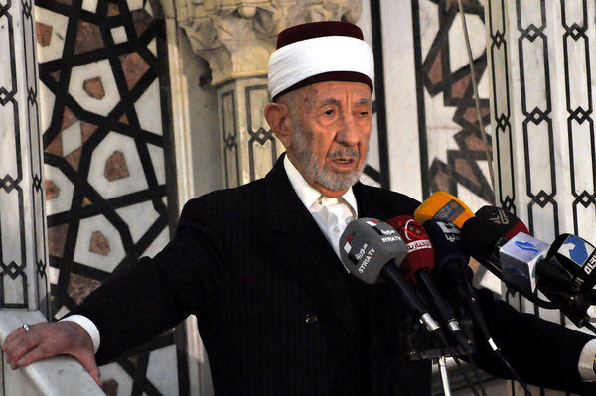 In this undated photo released by the Syrian official news agency SANA, Sheik Muhammad Bouti speaks at a news conference. The Sunni Muslim cleric and longtime supporter of President Bashar Assad was killed Thursday in a bombing at the Iman Mosque in Damascus, Syria.