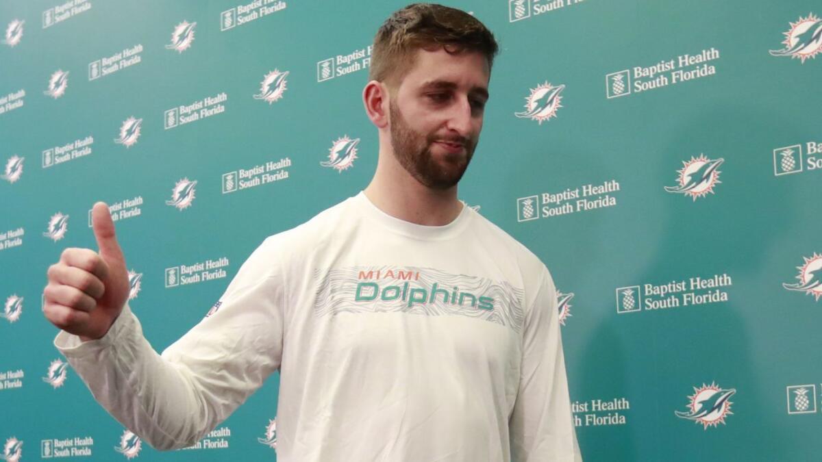 Miami Dolphins quarterback Josh Rosen gives a thumbs up after speaking at a news conference April 29 in Davie, Fla.