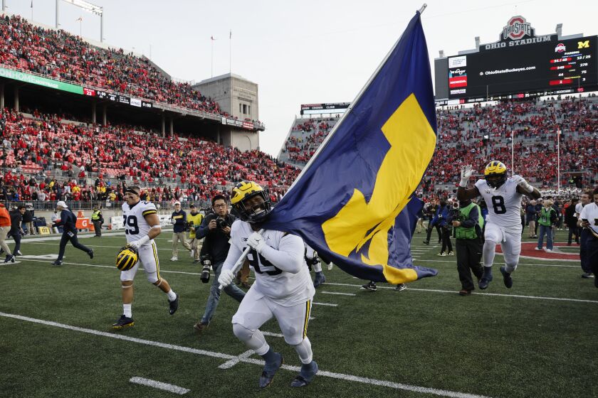 Michigan defensive lineman Cam Goode celebrates their win over Ohio State after an NCAA college football game on Saturday, Nov. 26, 2022, in Columbus, Ohio. (AP Photo/Jay LaPrete)