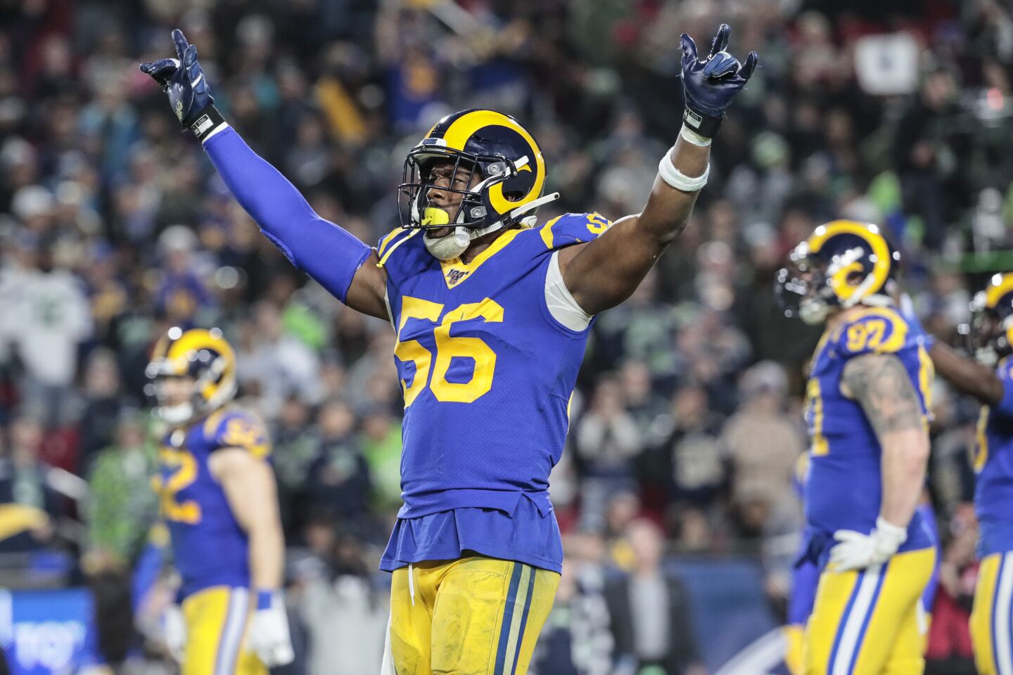 Rams linebacker Dante Fowler tries to pump up the crowd in the final minutes of a 28-12 victory over the Seattle Seahawks.
