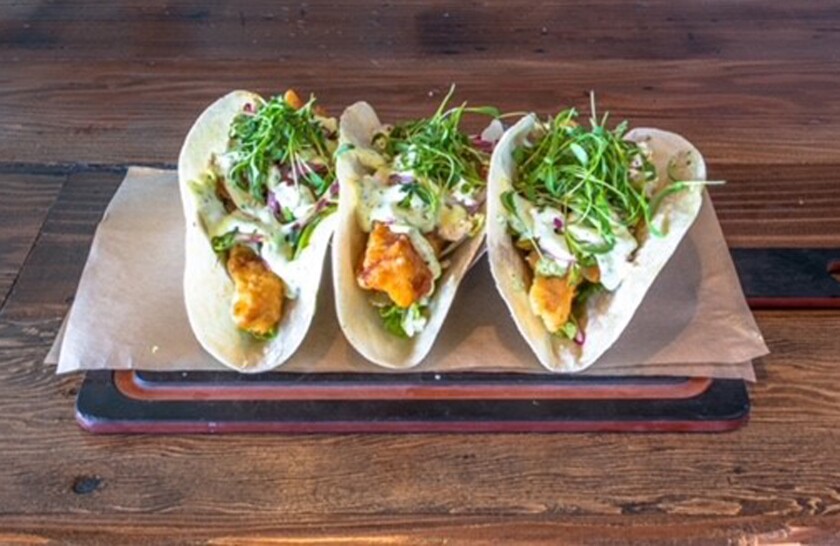 Beer-battered mahi tacos at The Duck Dive.
