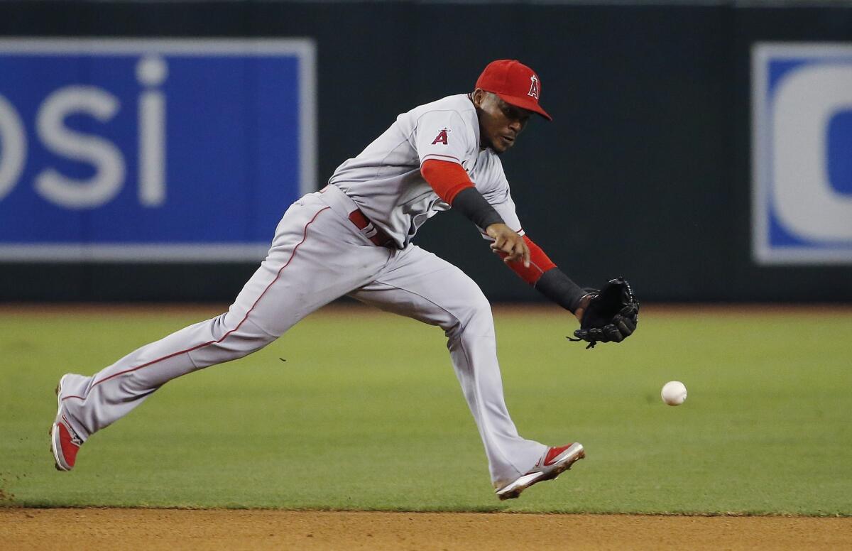 Erick Aybar tries in vain to catch up with a grounder hit by Arizona's Chase Anderson on Wednesday.