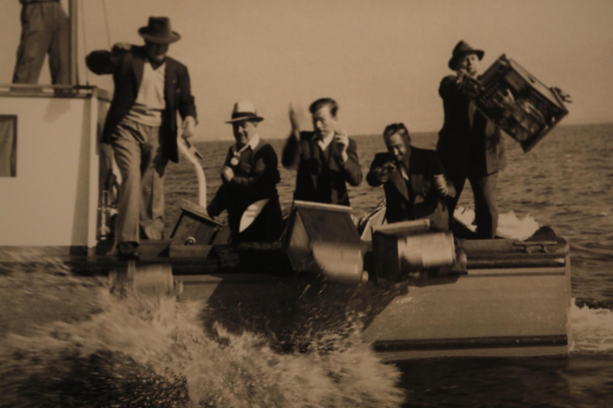 Officials dump slot machines from the Rex into Santa Monica Bay in 1939. 