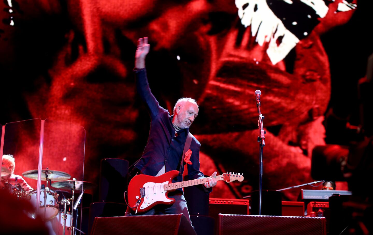 Pete Townshend strums his guitar in his trademark windmill style as The Who performs.