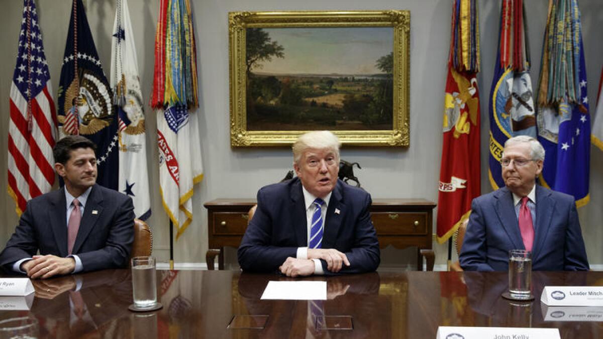 President Trump discusses tax changes with Speaker Paul Ryan (R-Wis.), left, and Senate Majority Leader Mitch McConnell (R-Ky.) in September at the White House.