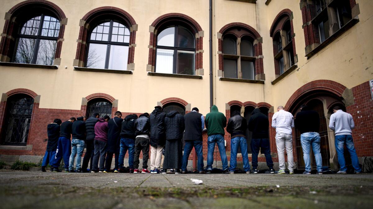 Salafi supporters pray during a public gathering on March 14, 2015, in Wuppertal, Germany.